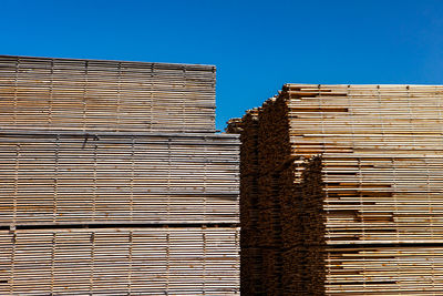 Low angle view of building against clear blue sky