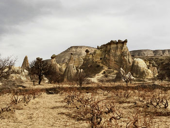 Rock formations in desert against sky