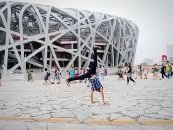 People in front of built structure