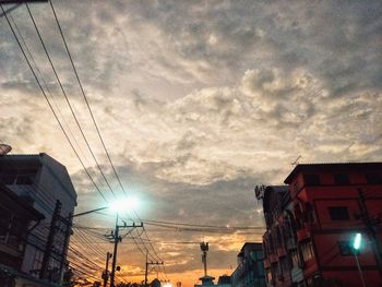 Low angle view of silhouette buildings against sky during sunset