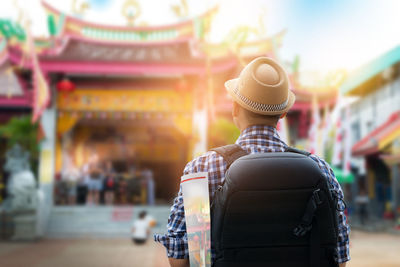 Man standing in front of temple