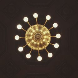 Low angle view of chandelier hanging from ceiling