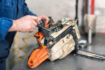 Man working on metal structure at workshop