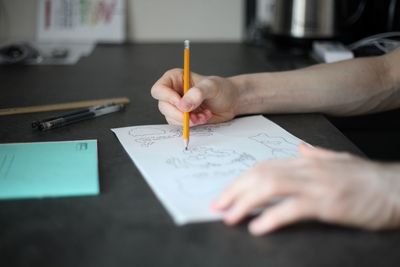 Close-up of hand holding paper