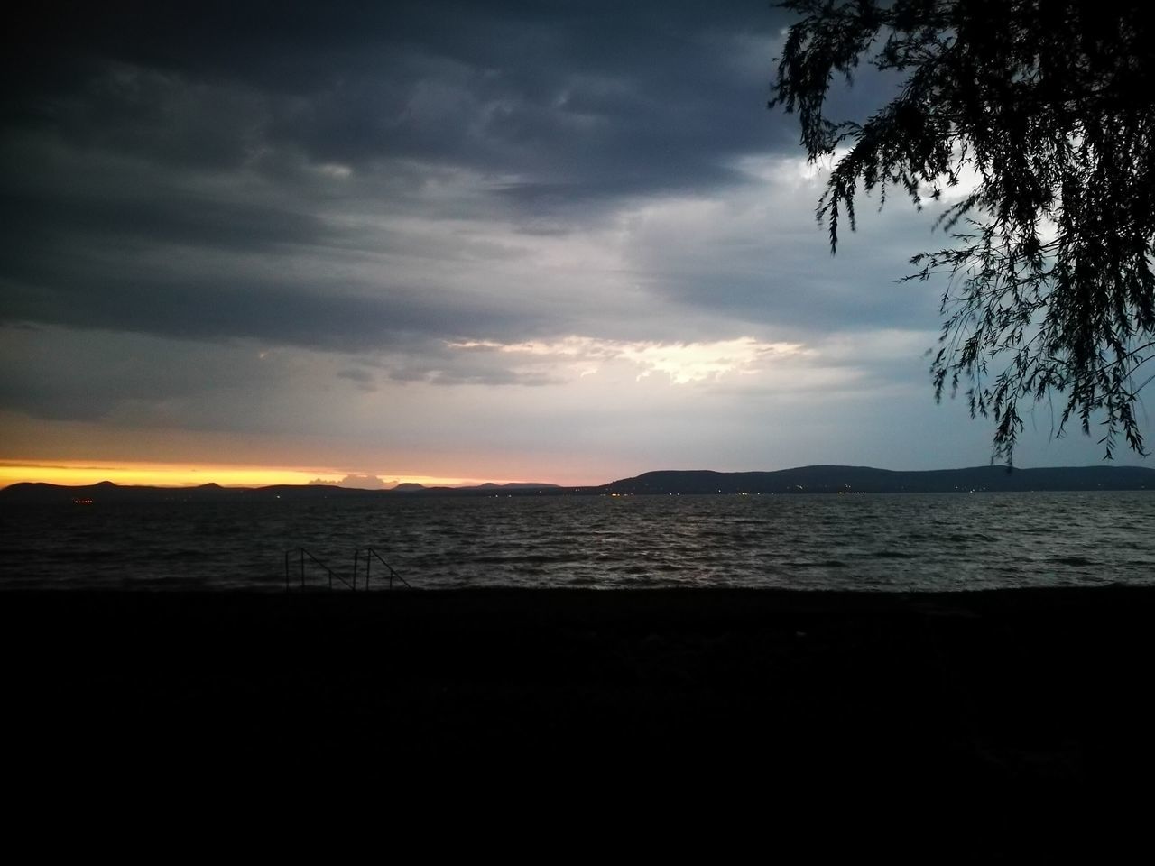 sunset, sea, beauty in nature, scenics, sky, silhouette, tranquil scene, tranquility, nature, no people, water, beach, outdoors, cloud - sky, tree, horizon over water, landscape, day