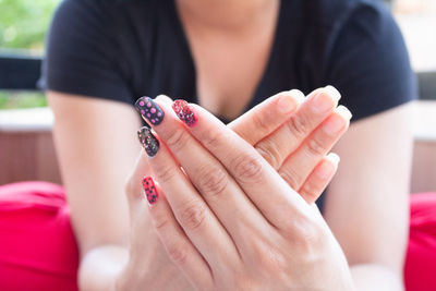 Close-up of woman holding hands