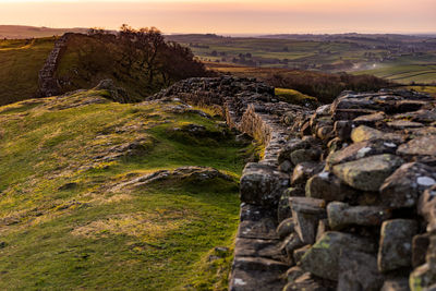 Landscape against sky during sunset