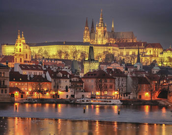 Illuminated buildings in city at night