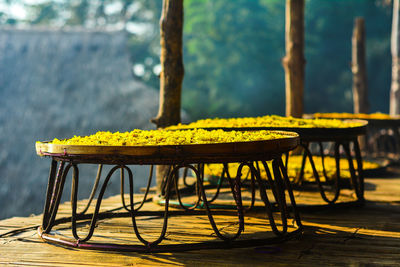 Close-up of yellow chair on table