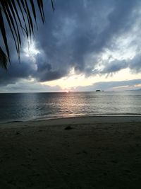 Scenic view of sea against sky at sunset