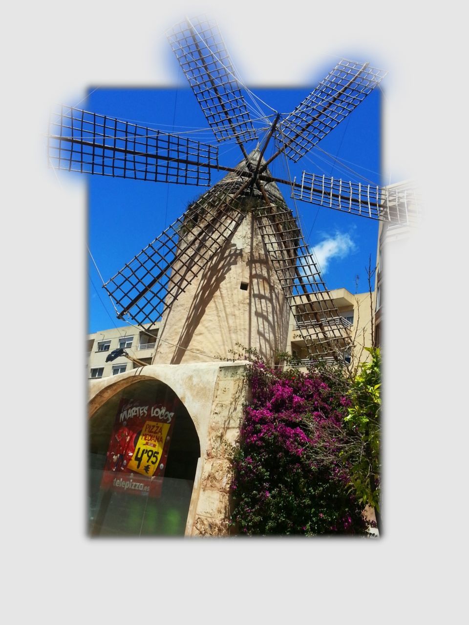 architecture, built structure, building exterior, low angle view, religion, clear sky, church, place of worship, tree, sky, windmill, wind power, alternative energy, spirituality, environmental conservation, day, renewable energy, no people