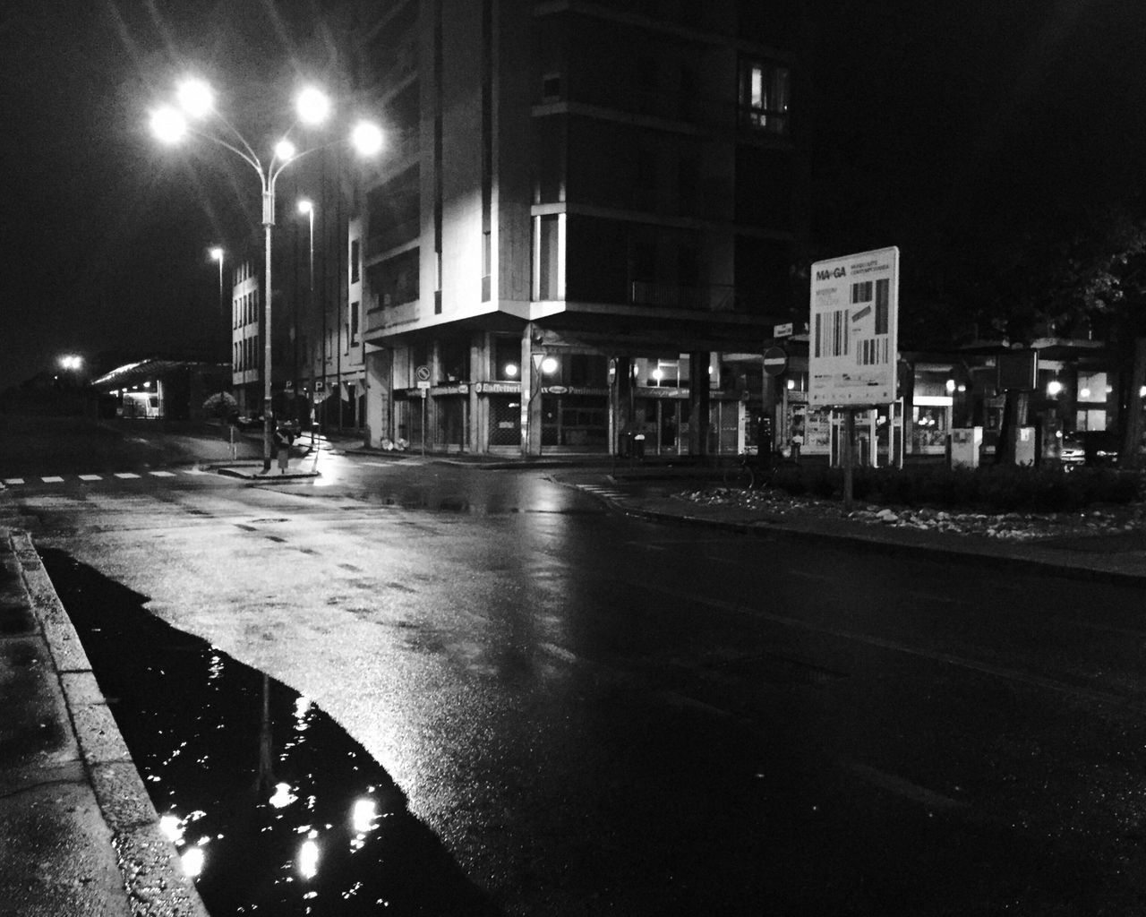 VIEW OF CITY STREET AT NIGHT