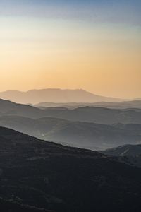 Scenic view of mountains against sky during sunset