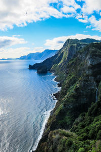 Scenic view of sea against cloudy sky