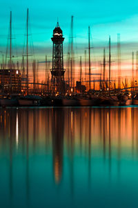 Sailboats in sea against sky during sunset