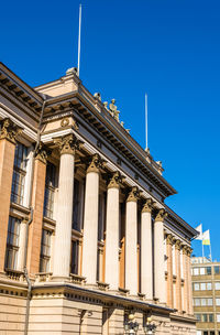 Low angle view of building against blue sky