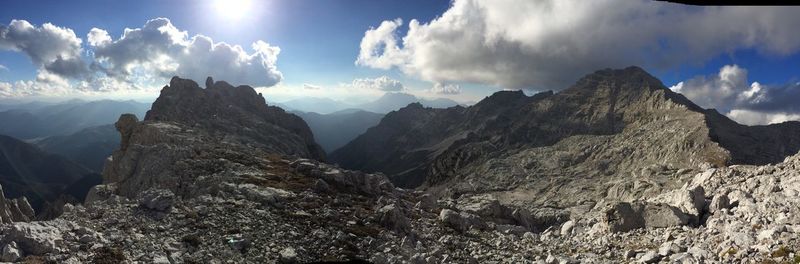 Scenic view of mountains against cloudy sky