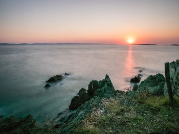 Scenic view of sea against sky during sunset
