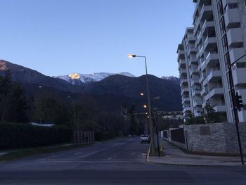 Road in city against clear sky
