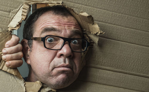 Close-up portrait of man wearing eyeglasses