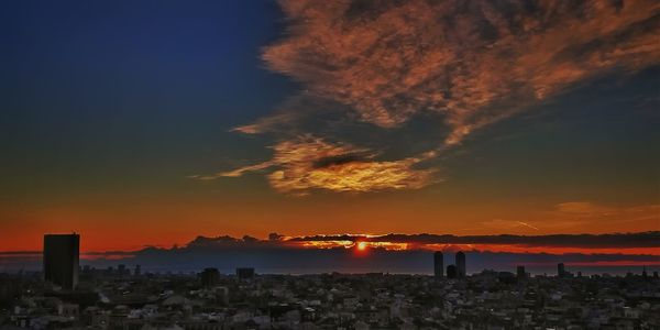 View of cityscape against sky during sunset