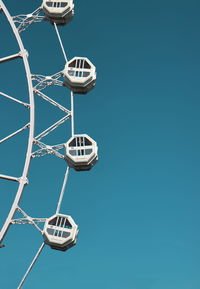 Low angle view of basketball hoop against clear blue sky