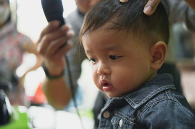 Portrait of cute boy with mother