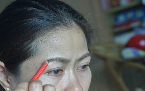 Close-up woman doing make-up