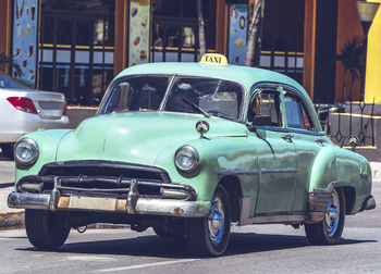 Vintage car on road in city