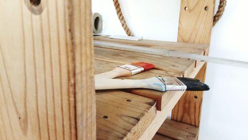 Paintbrushes on wooden table