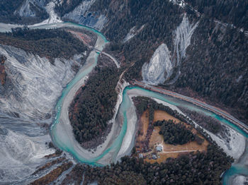 Aerial view of river flowing amidst valley