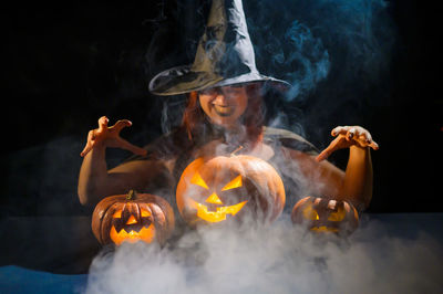 Close-up of jack o lantern against black background