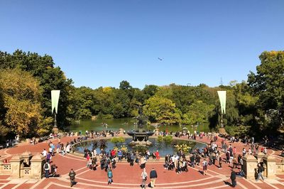 People at bethesda fountain against clear sky