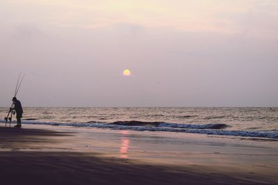 Scenic view of sea against sky at sunset