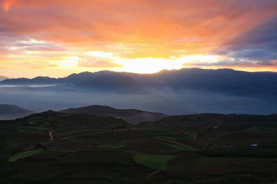 Scenic view of mountains against sky during sunset