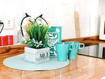 Close-up of coffee cup on table at home