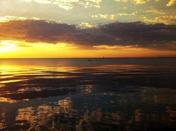 Scenic view of sea against cloudy sky