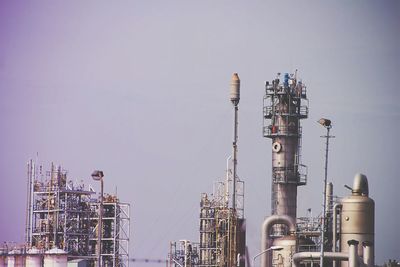 Low angle view of factory against sky