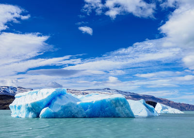 Scenic view of frozen lake against sky