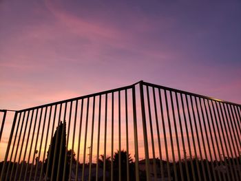 Low angle view of silhouette building against sky during sunset