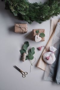 Directly above shot of gift boxes and leaves on table