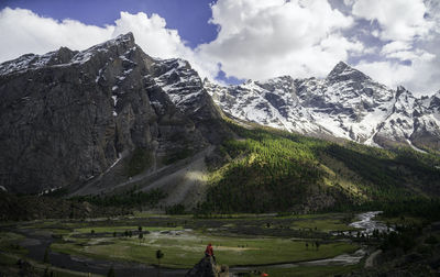 Scenic view of snowcapped mountains against sky