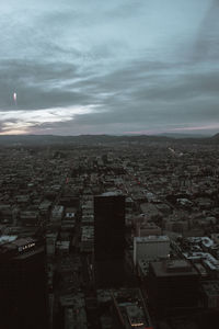 High angle view of city buildings against sky