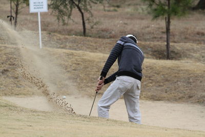 Man standing on golf course