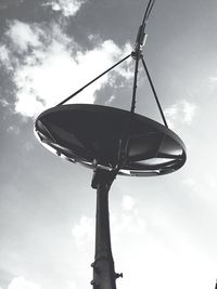 Low angle view of windmill against sky