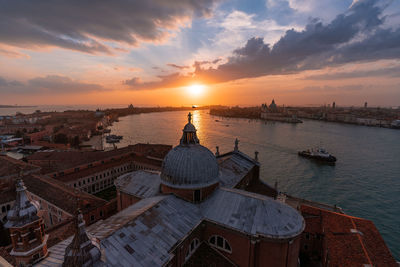 Panoramic view of buildings against sky during sunset