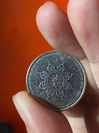 Close-up of human hand holding metal