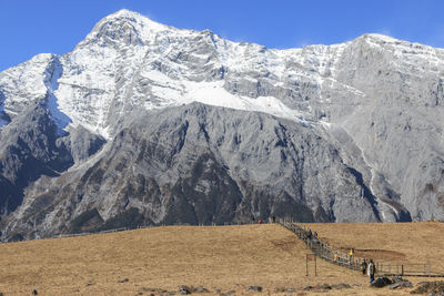 Scenic view of mountains against clear blue sky