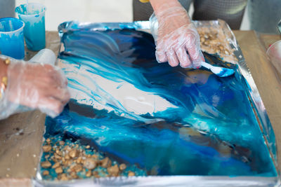 Cropped hand of person cleaning