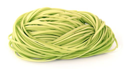 Close-up of green leaf against white background